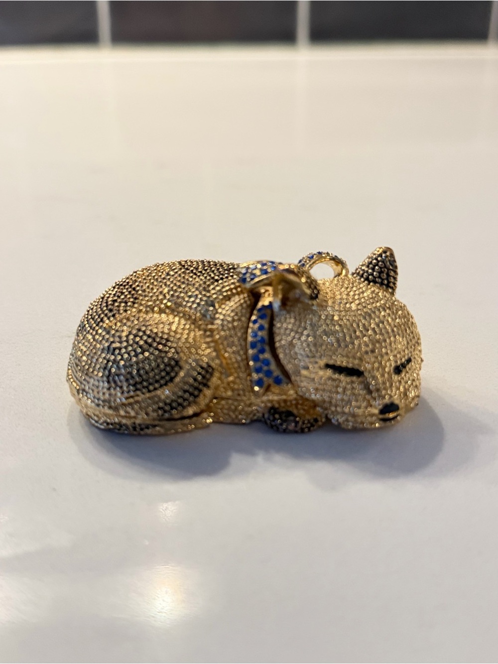 Gold-tone Sleeping Puppy Pin with Blue Collar